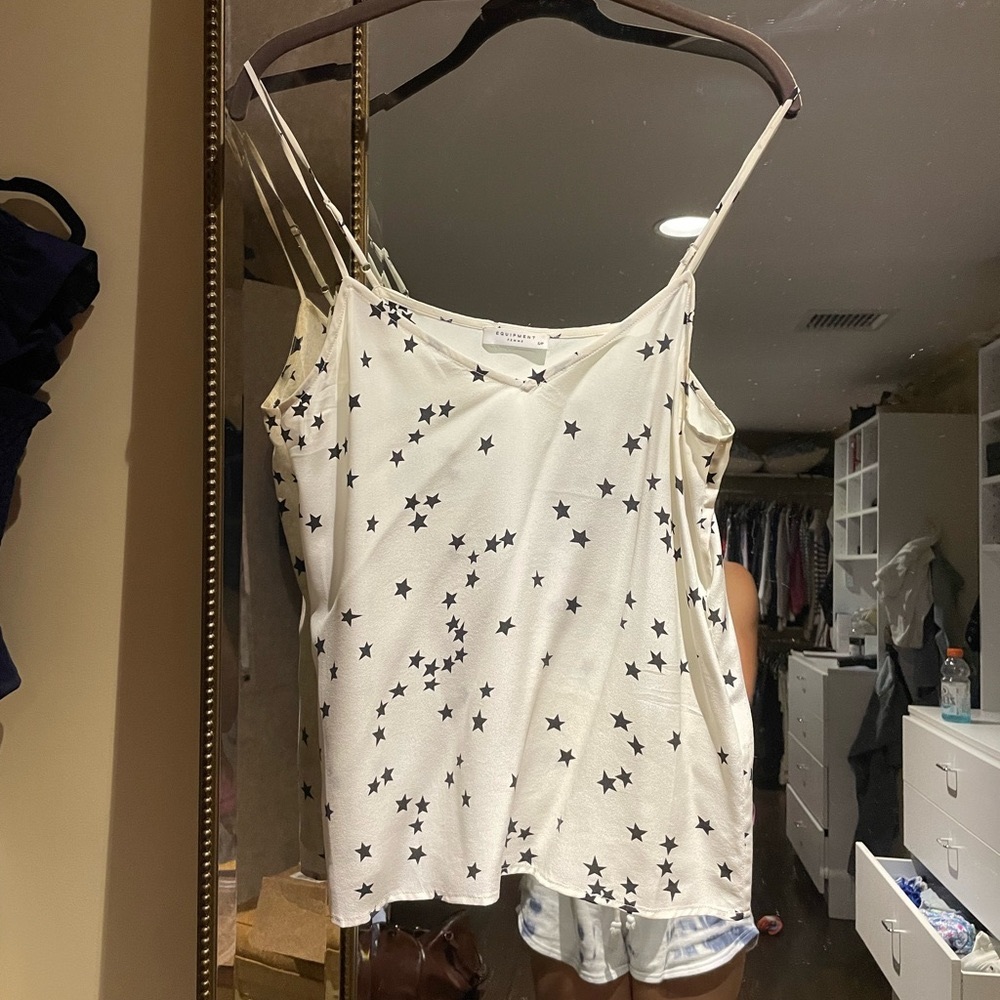 Silk rarely made equipment tank size small. Very flattering.